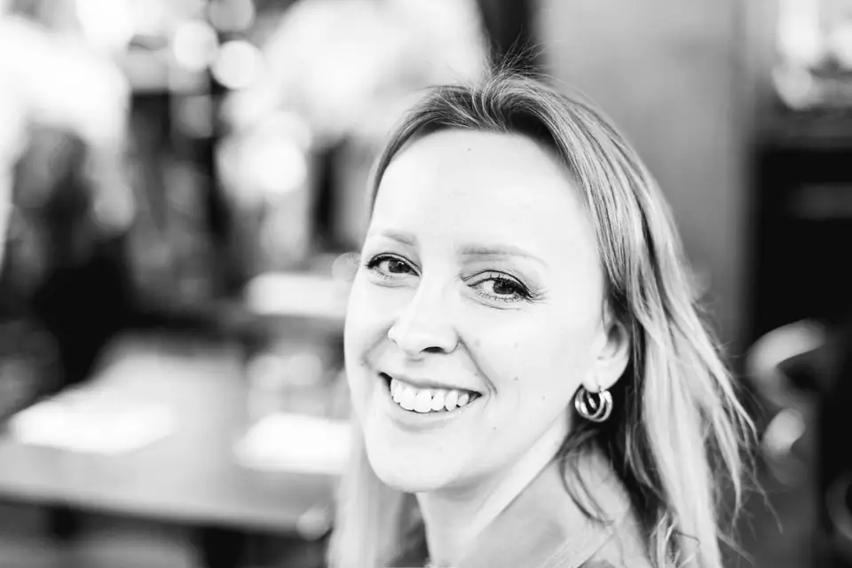 Black-and-white portrait of Svitlana, smiling.